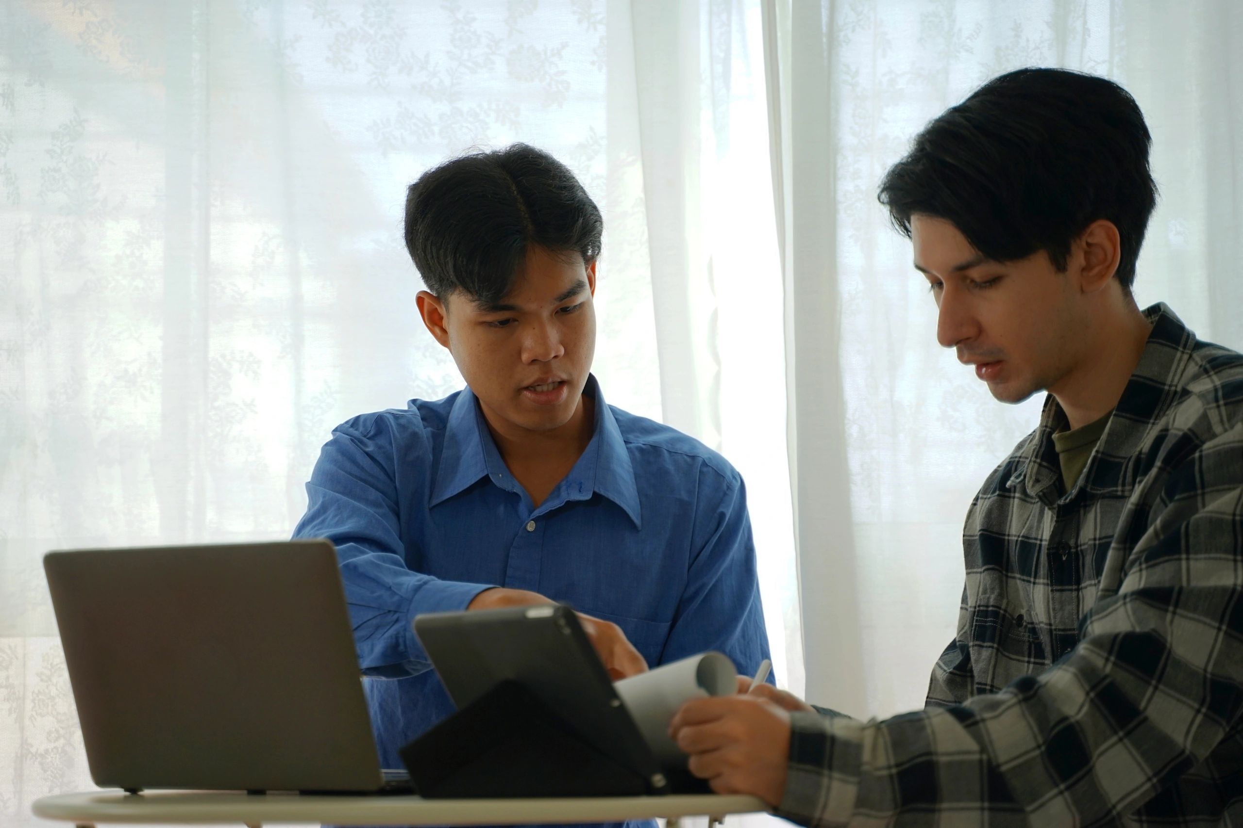 Professionals reviewing business funding options together