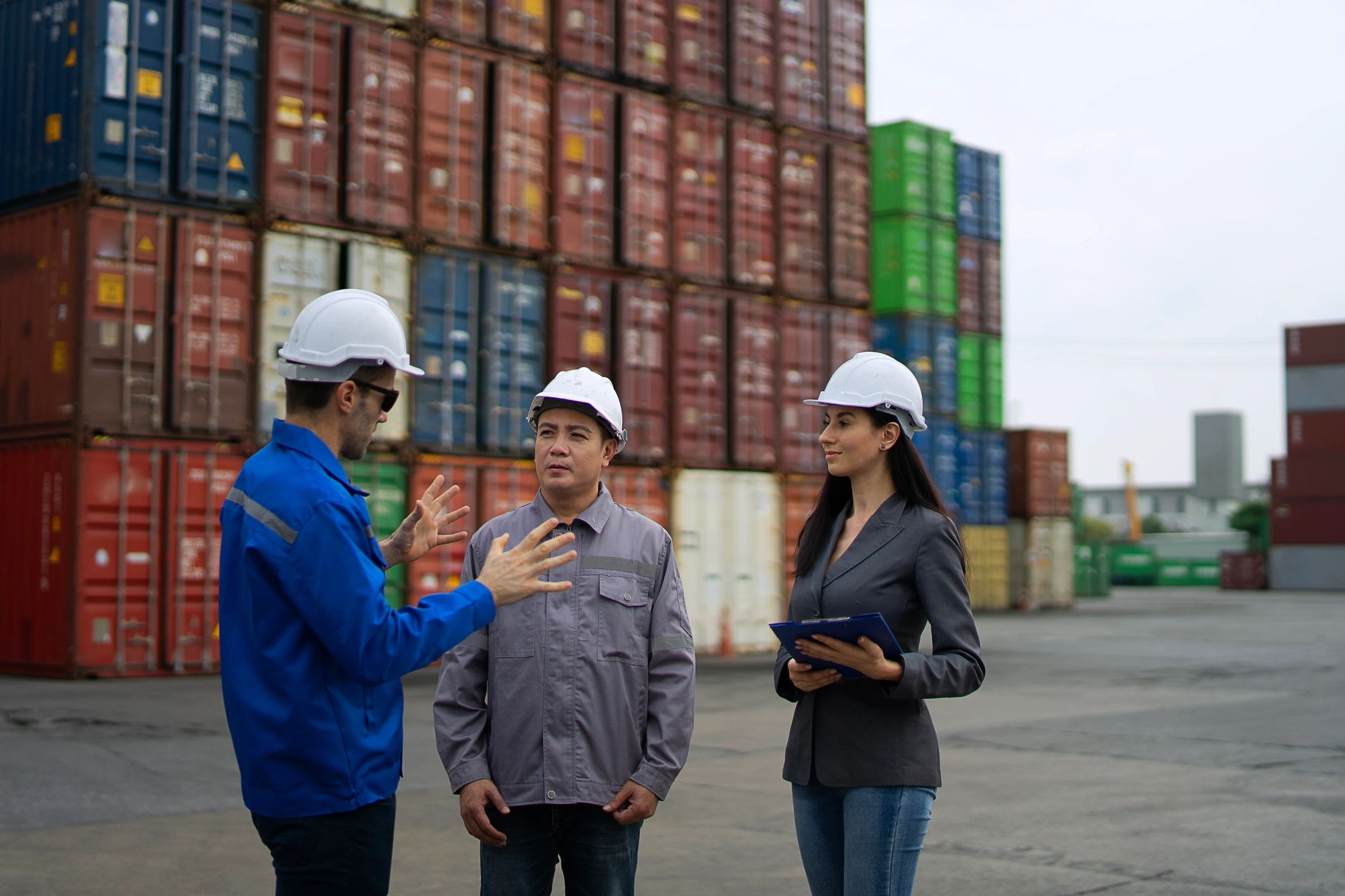 Workers at a logistics container warehouse